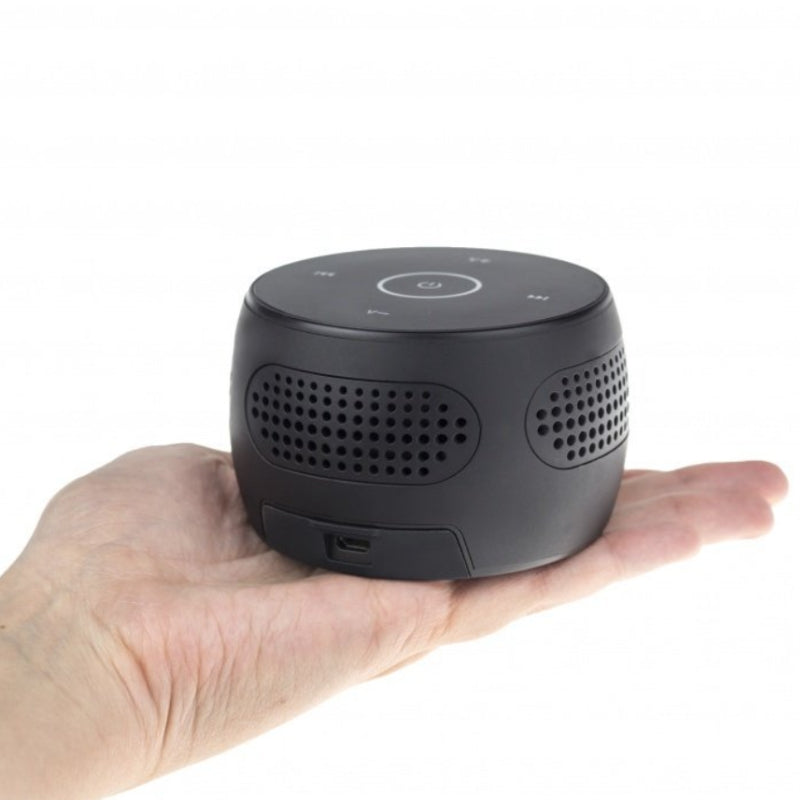 Hand holding Bluetooth speaker surveillance camera