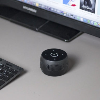 Nanny cam bluetooth speaker on a desk